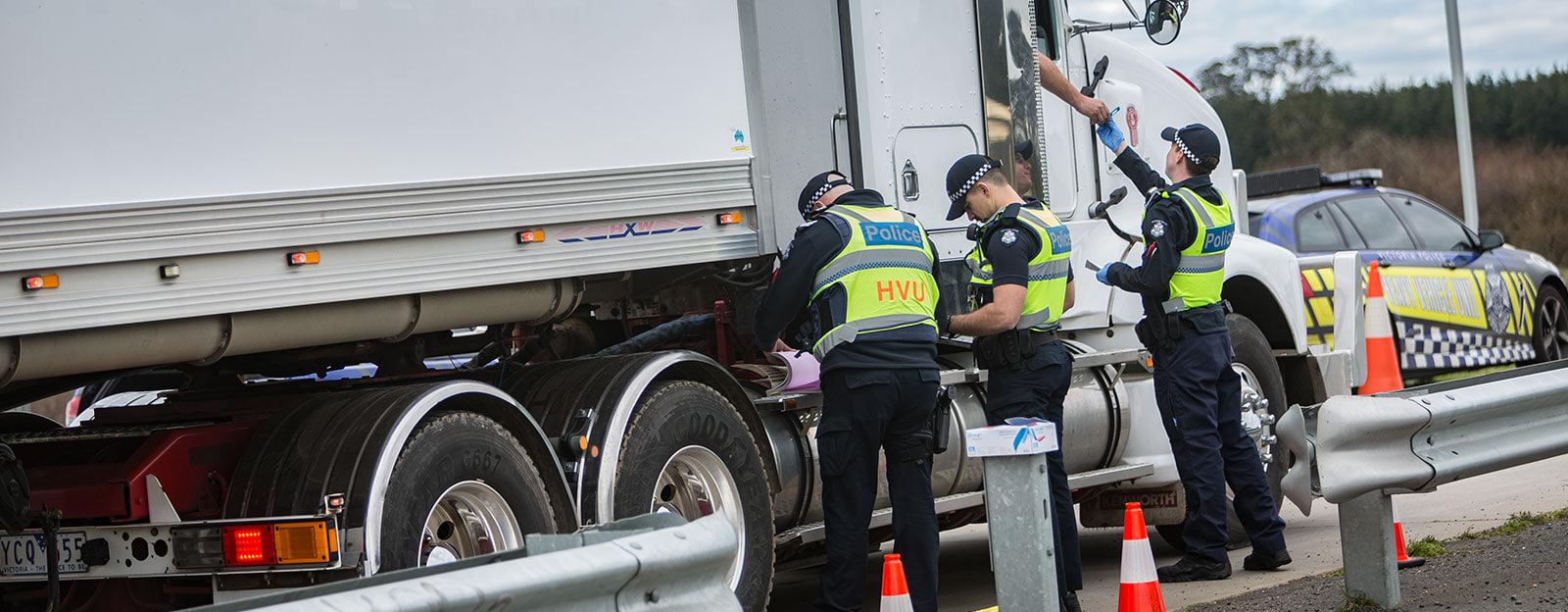 Police stop trucks to inspect vehicles