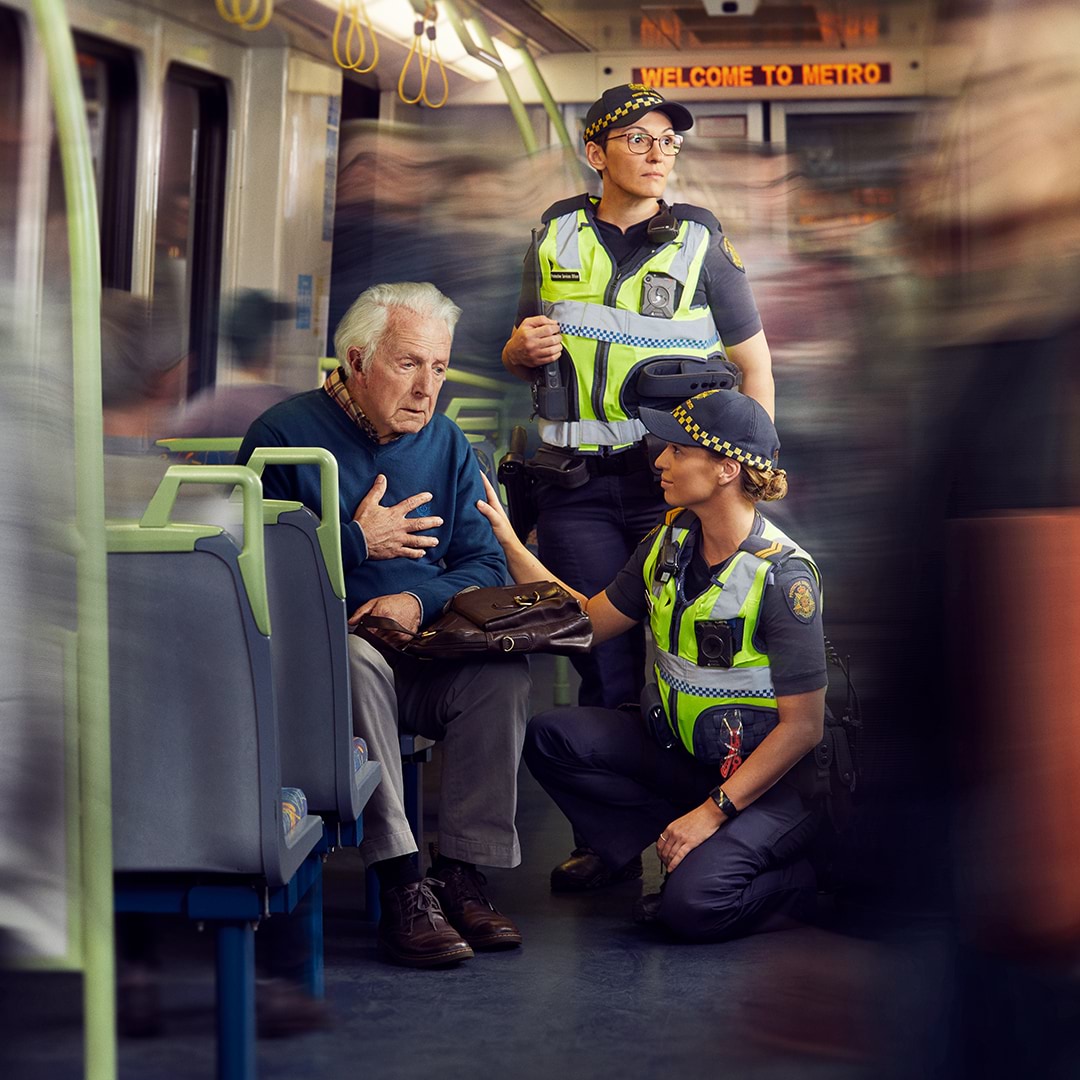 SO's speaking with a man on a train