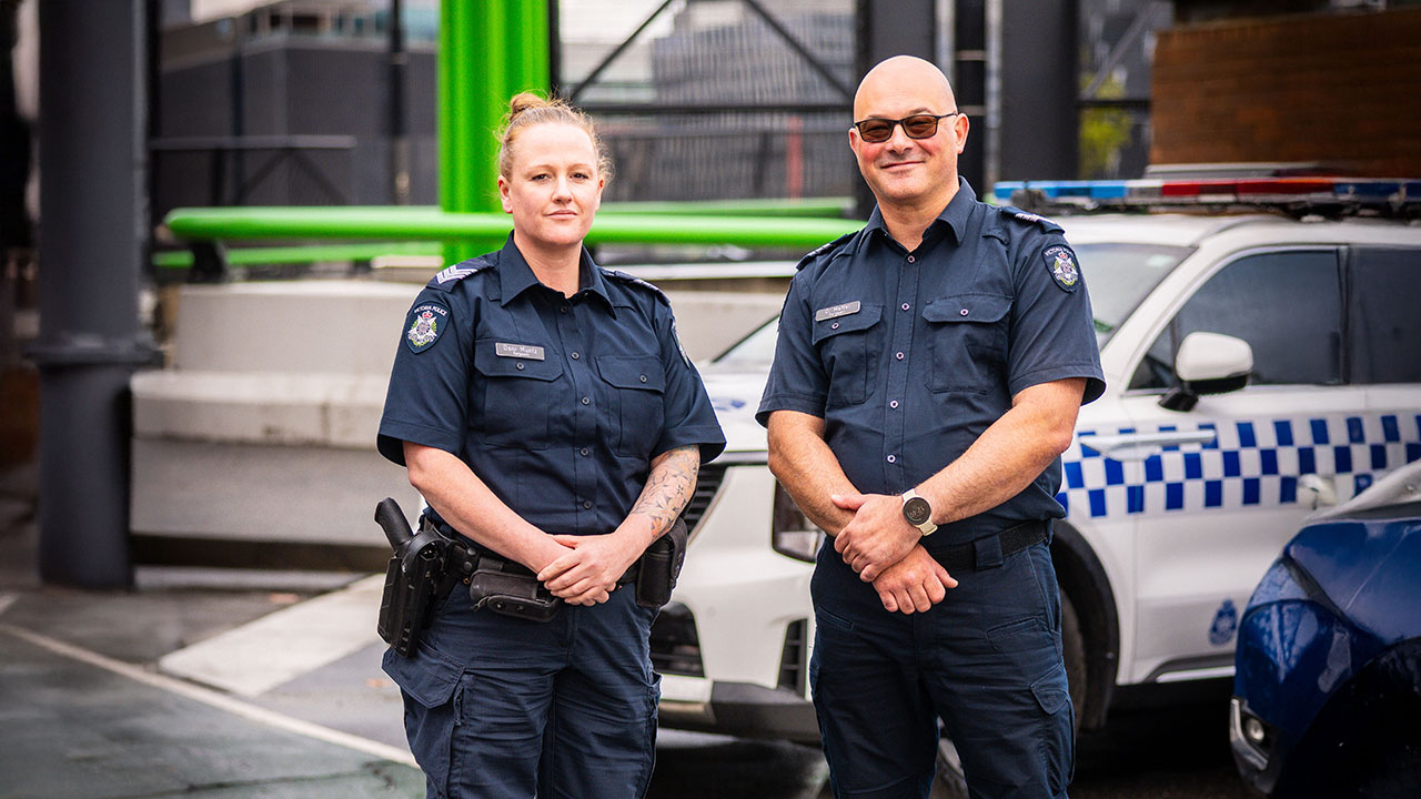 Police Life podcast - sergeants Dan Maffei and Dani Muntz standing on the street