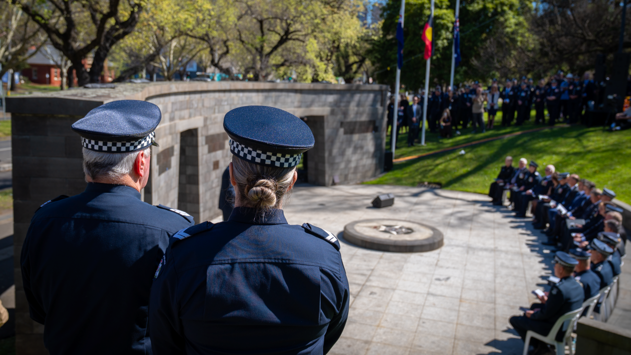 Victoria Police officers pay their respects at the Police Memorial. 