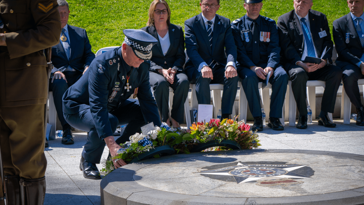 Chief Commissioner Mike Bush lays a wreath at the Police Memorial. 