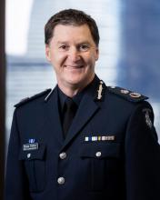 Decorative photo of Shane Patton, APM Chief Commissioner, Victoria Police. He is smiling and in Victoria Police Dress Uniform.